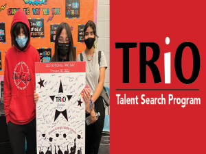 image of three TRIO students holding a poster