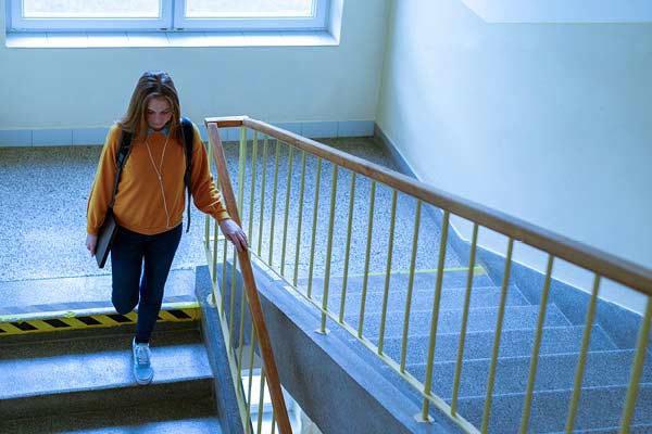 Student walking down stairs