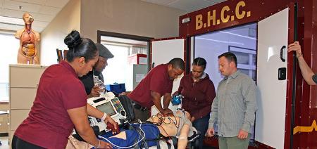 paramedics students practicing on equipment