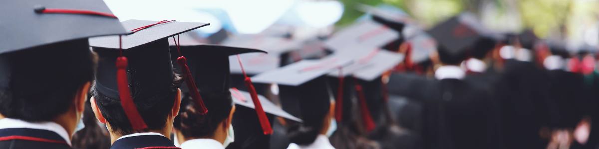 students wearing graduation caps 