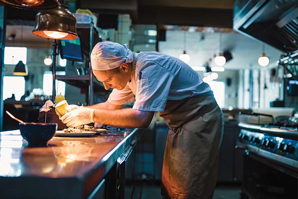 A chef preparing a delicious item