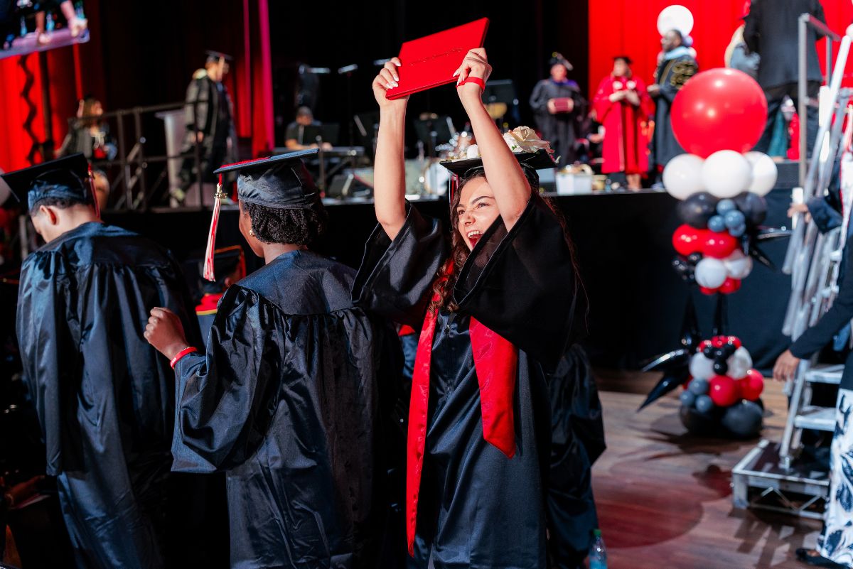 Student lifting diploma