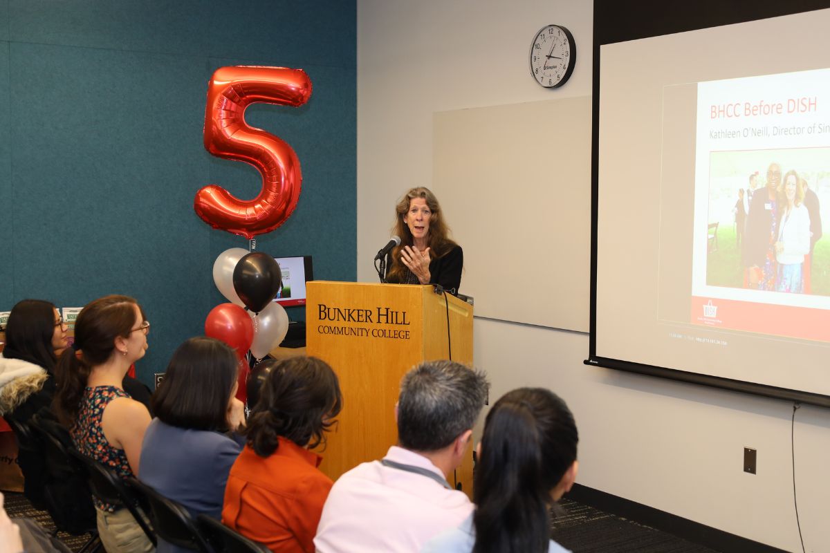 Kathleen speaking at the poidium