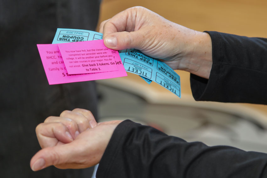 Hands holding post-it notes for the retreat exercise