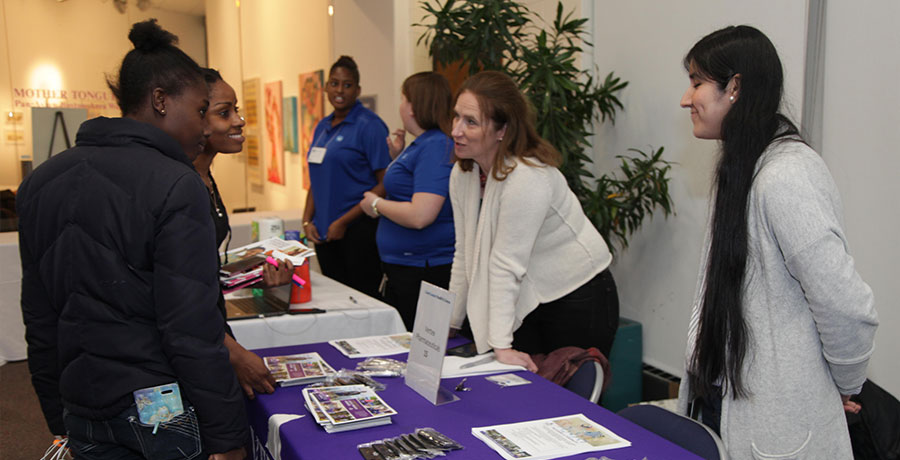 students meeting with reps at the career fair