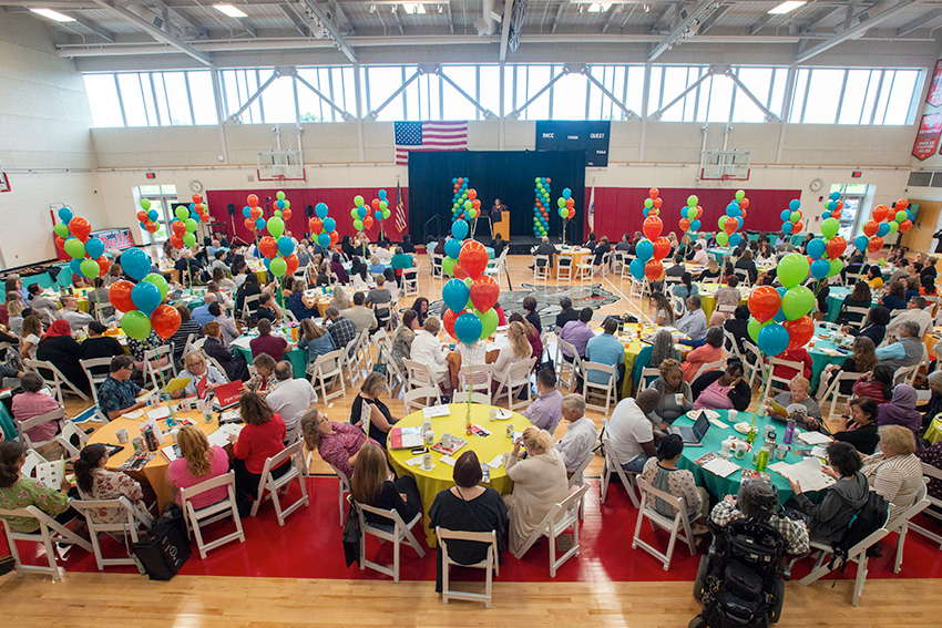 faculty and staff in the gym at convocation