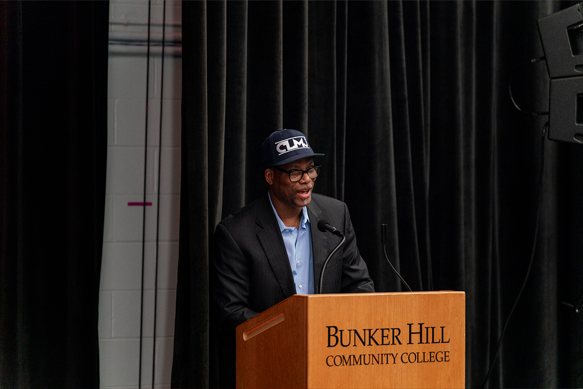 faculty member speaking at a podium