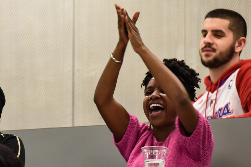 A lady in the audience clapping 