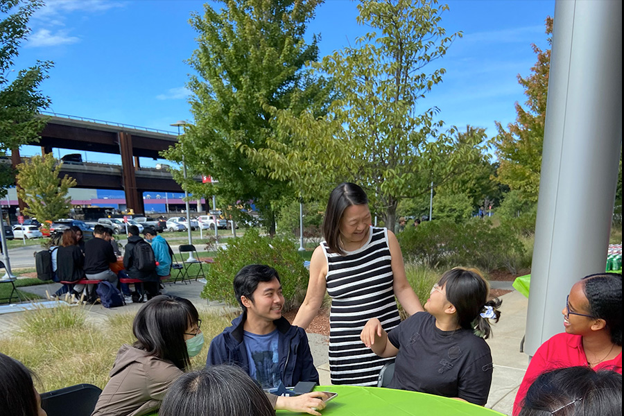 Pam Eddinger meeting talking with seated students