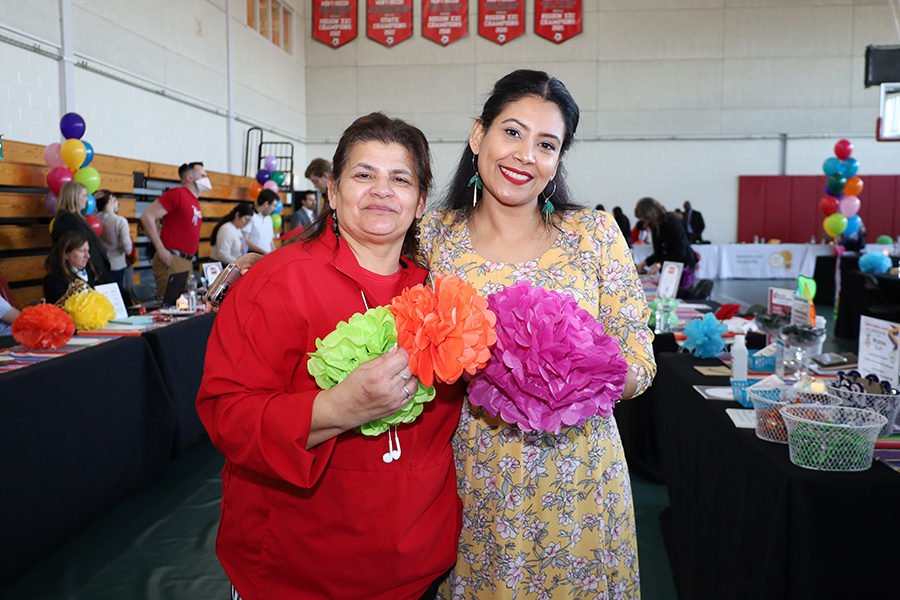 Two women with a flower