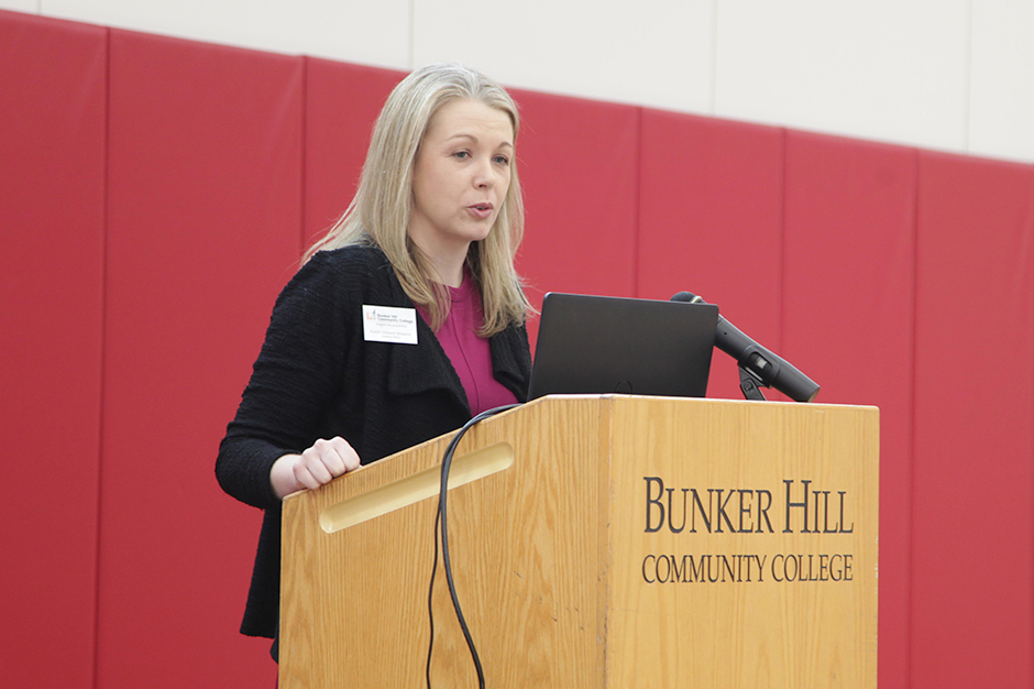 Austin Mirasolo speaking at a podium