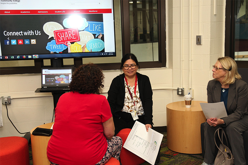 three women sitting talking