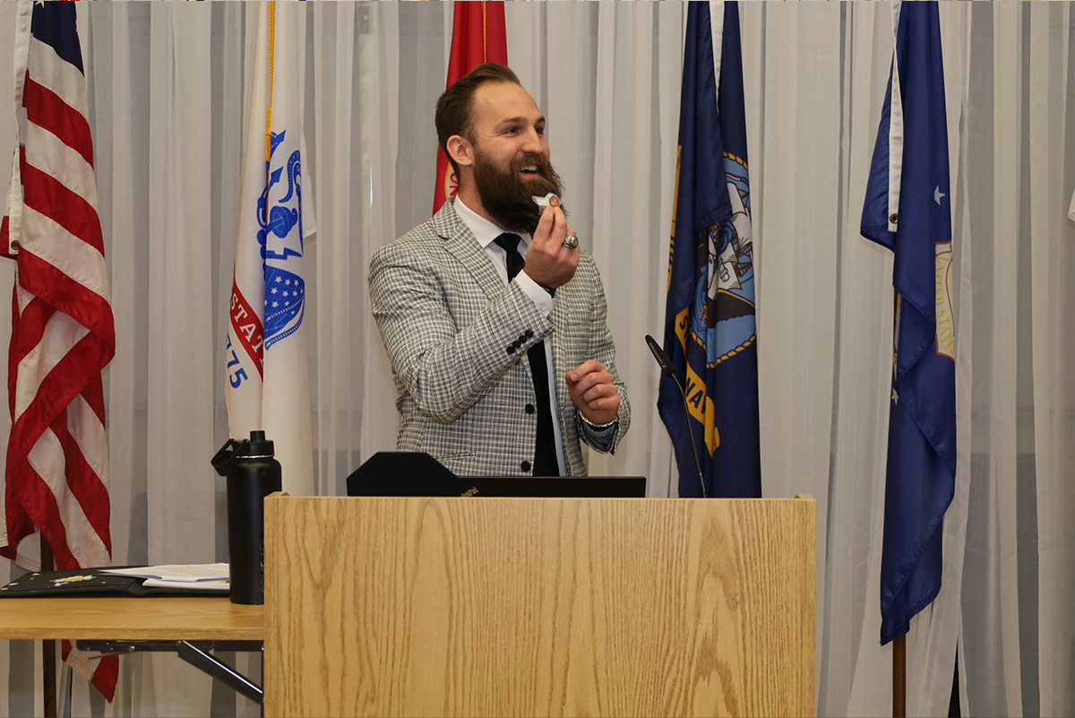 Peter Troiano speaking at podium