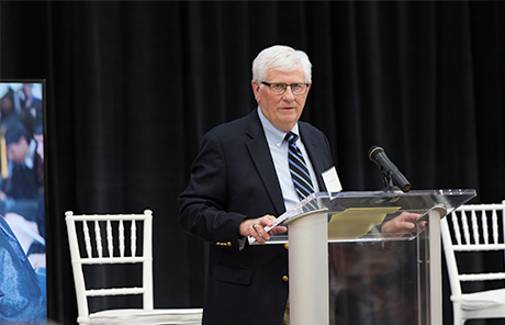 man speaking at a podium