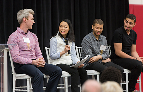 four people talking on stage