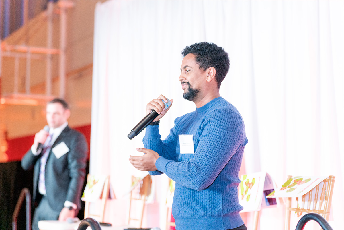 man speaking into a microphone