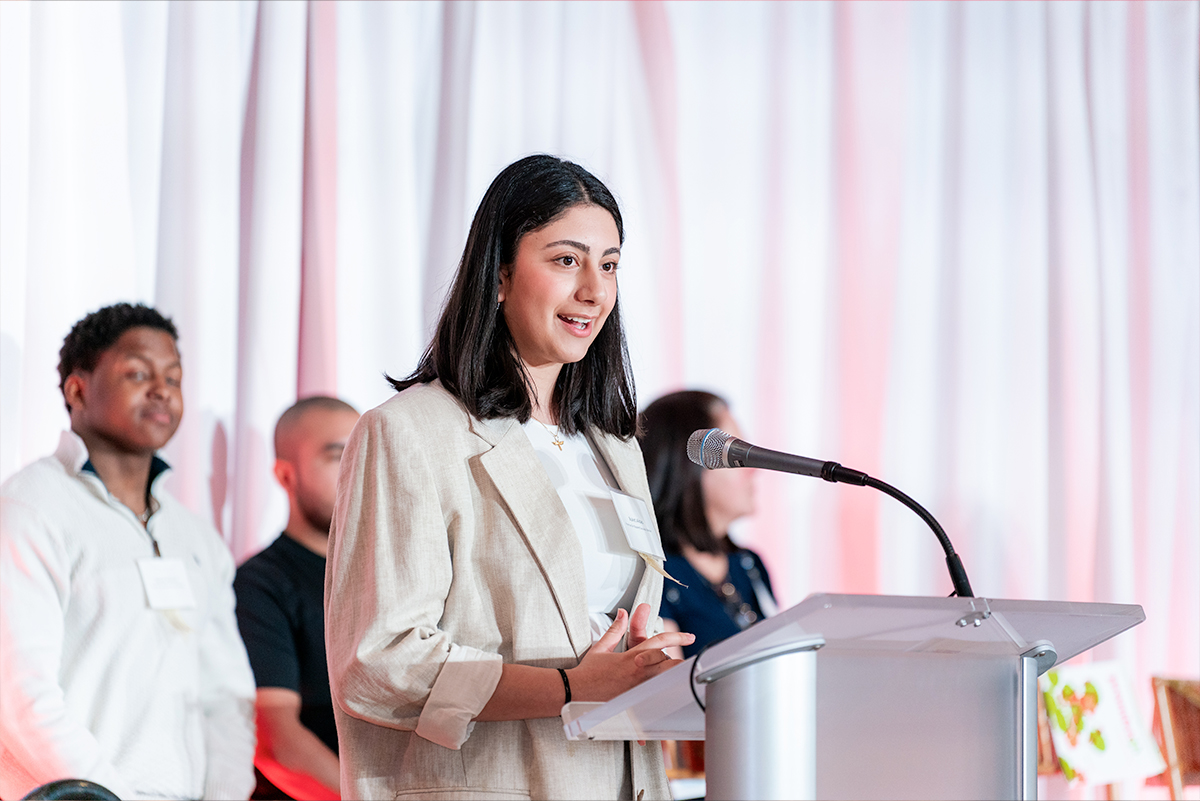 woman speaking at a podium