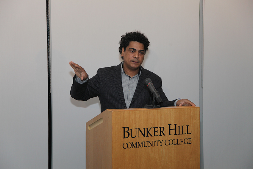 man speaking at a podium