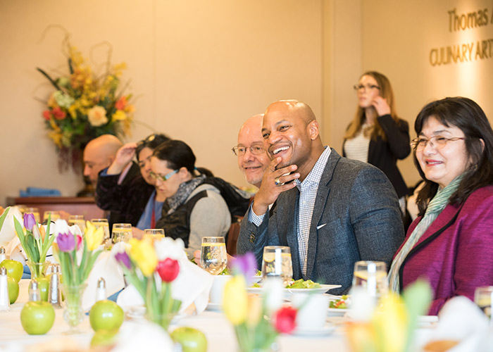 Wes Moore enjoying a meal in the culinary arts dining room