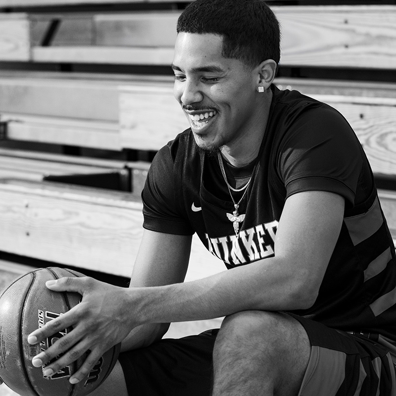 Gio Cordero Novas sitting down, black and white photograph