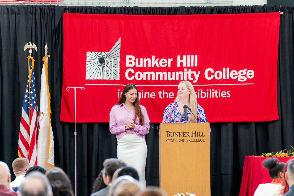 nursing faculty at podium