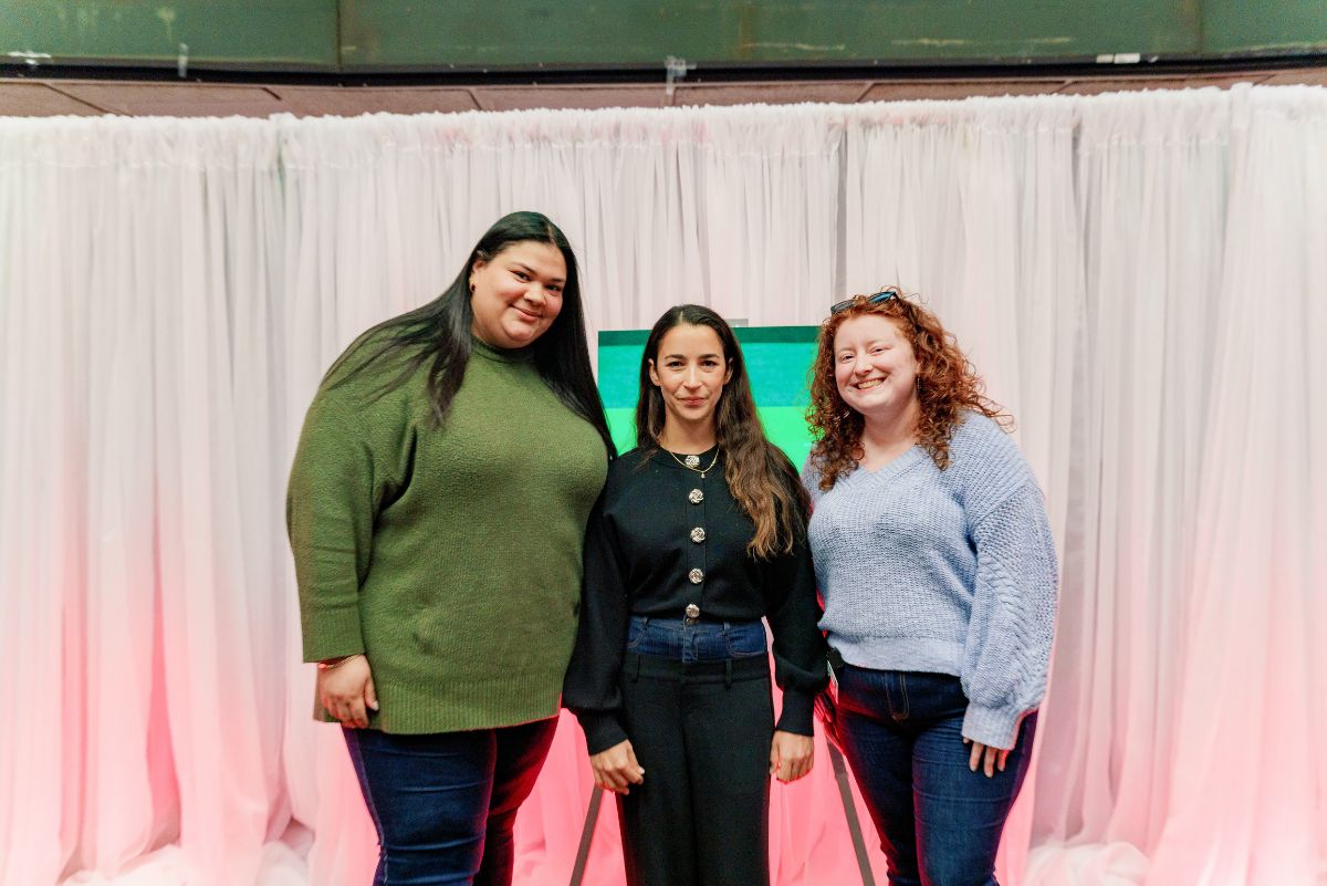 Aly Raisman posing with students