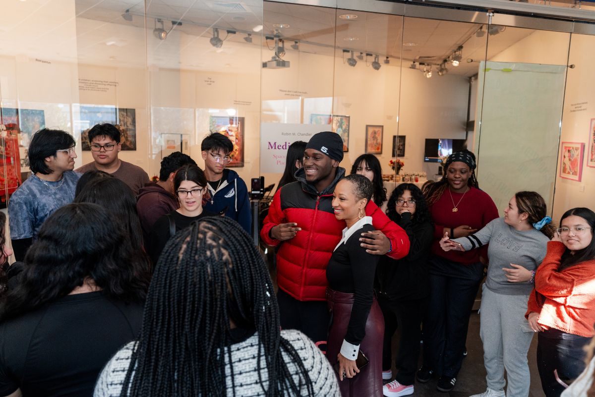 Monique Coleman with students