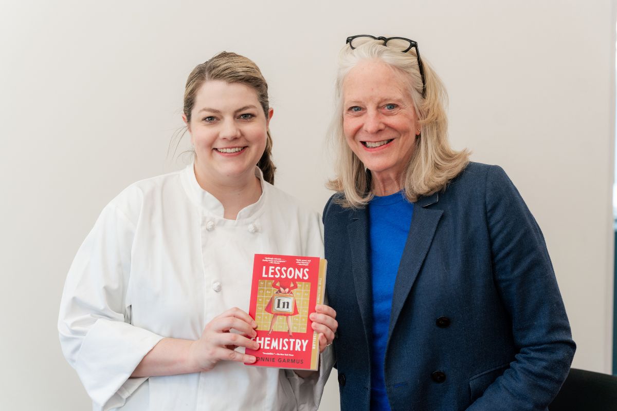 Bonnie Garmus and student holding abook