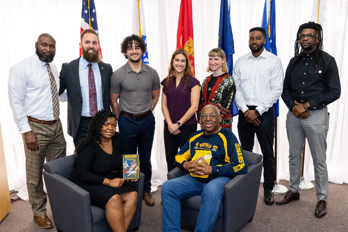 Robert Harris and Naomi posing with others at event