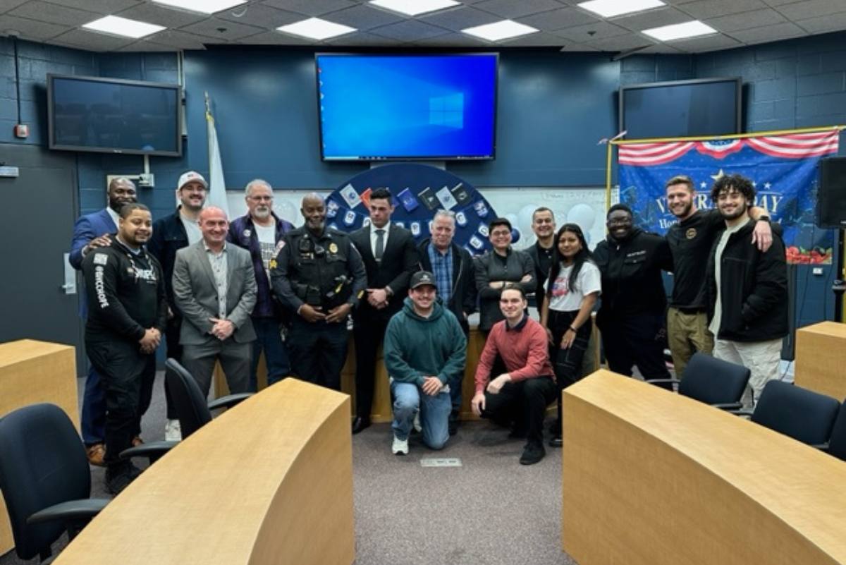 People posing at Veterans Day event