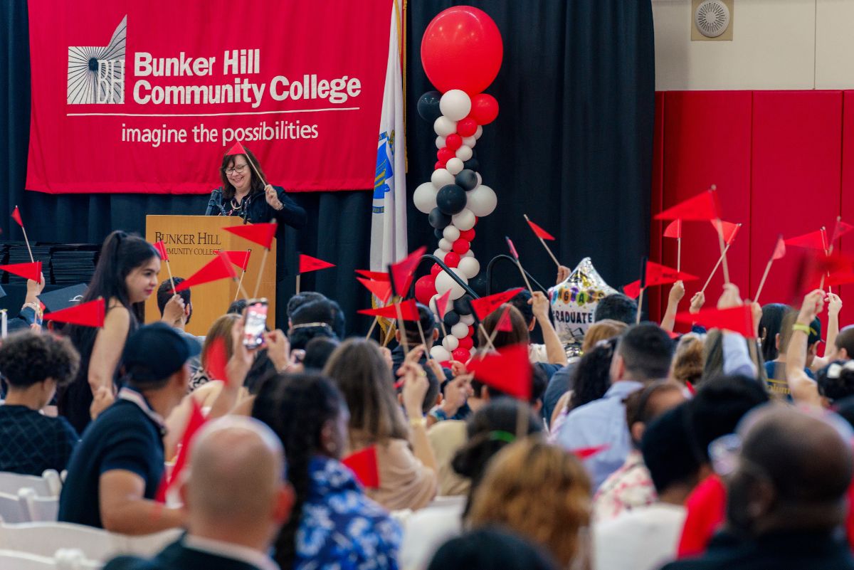 Students waving flag