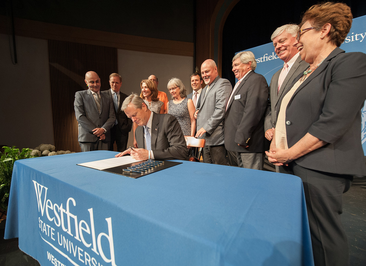 Governer Baker signing the Capital Improvements bill