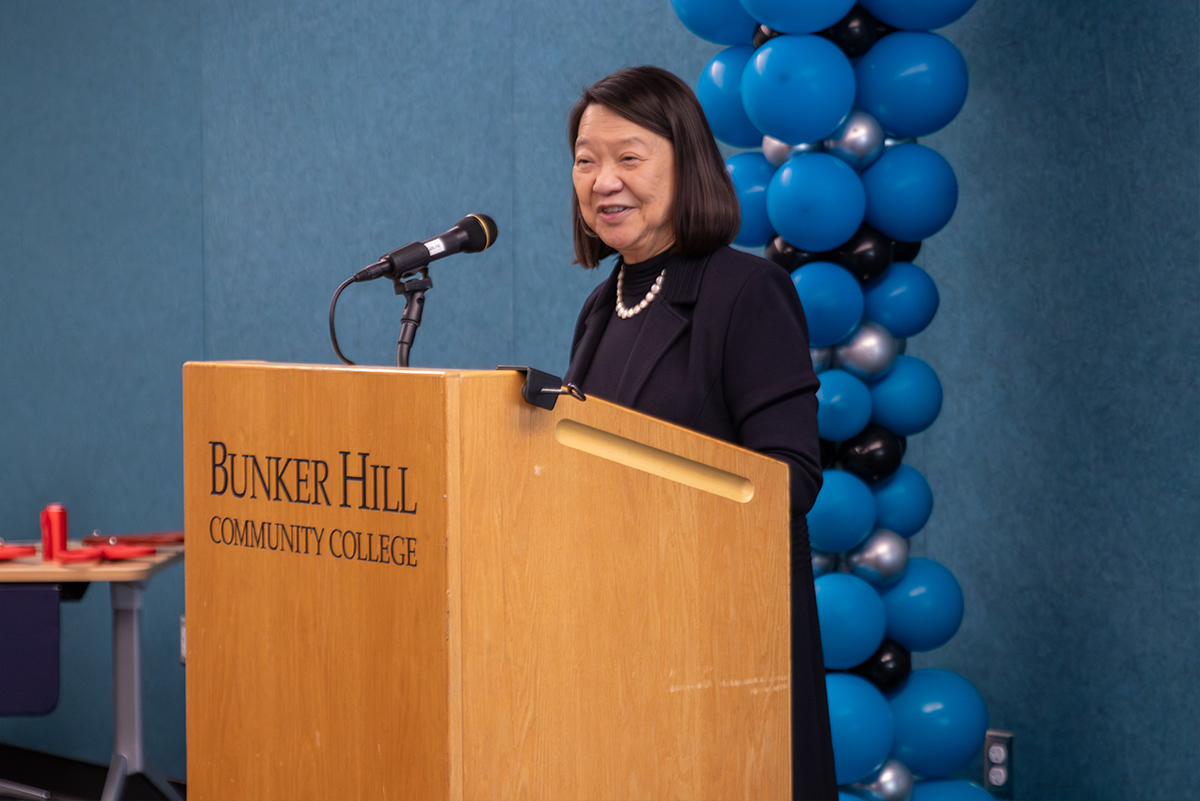 Pam Eddinger speaking at a podium