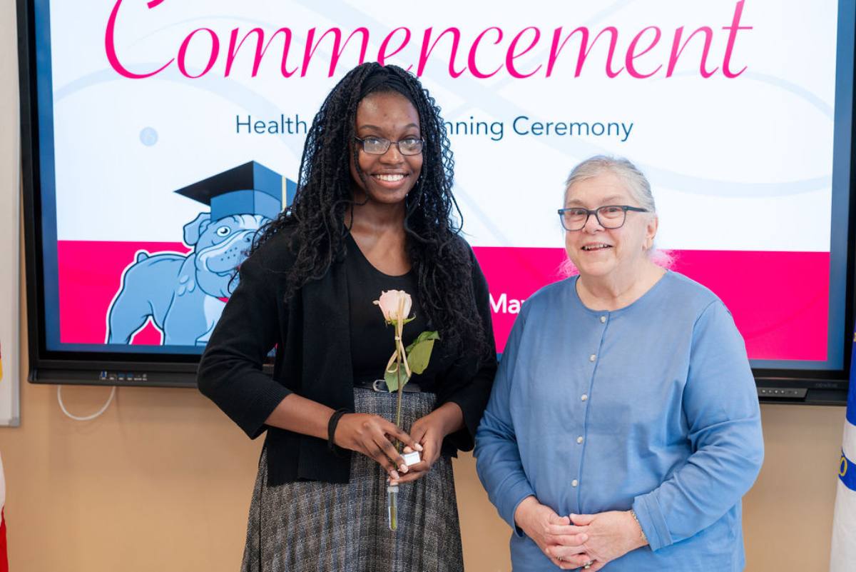 student getting her pin