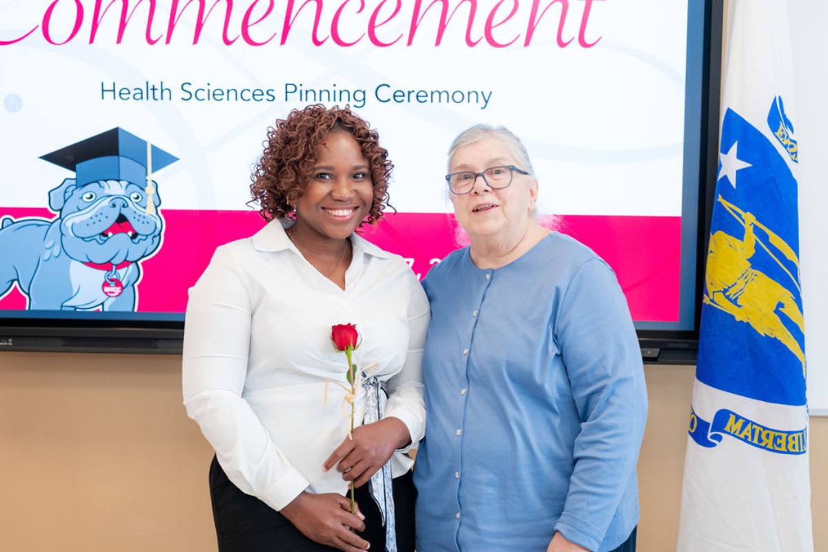 student getting her pin