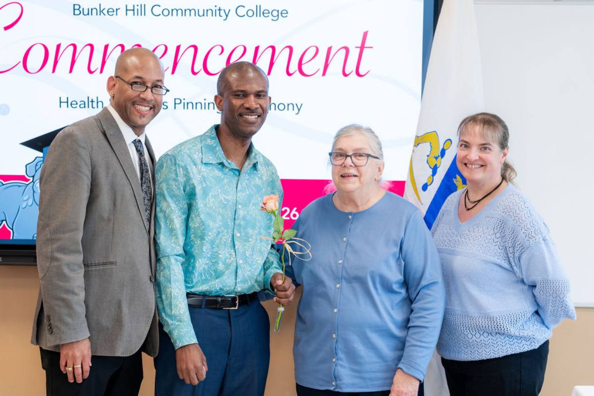 student receiving his pin