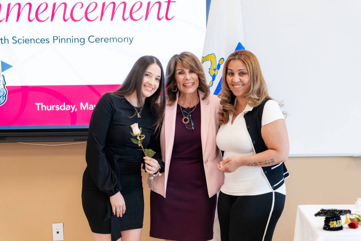 student receiving her pin