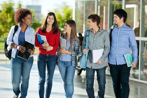 students walking and talking in a hallway